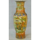 A large ceramic painted and transfer design Oriental vase with gilded lion's head ring handles.