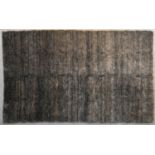 A contemporary rug with scrolling design on a field of shades of taupe and grey. L.270x180cm