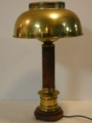 A vintage brass and leather desk lamp with classical style column resting on a carved base. H.59cm