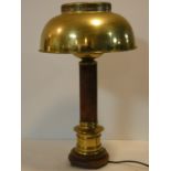 A vintage brass and leather desk lamp with classical style column resting on a carved base. H.59cm