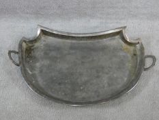 A large silver plated two handled tray with a repousse design border with oval cartouches of putti