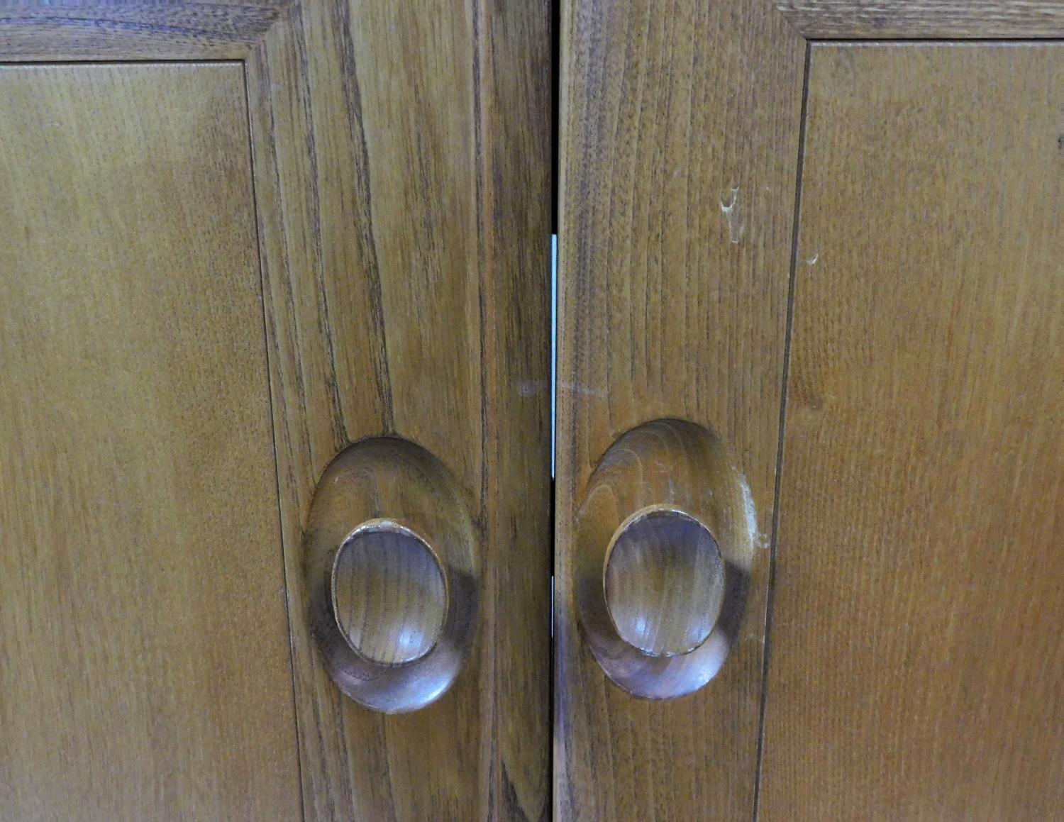 A vintage elm Ercol cabinet with panel doors and drop down base door fitted for HI Fi. H.94xW.85xL. - Image 10 of 13