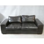 A vintage style Collins & Hayes brown leather upholstered two seater sofa. H.70 W.202 D.100cm