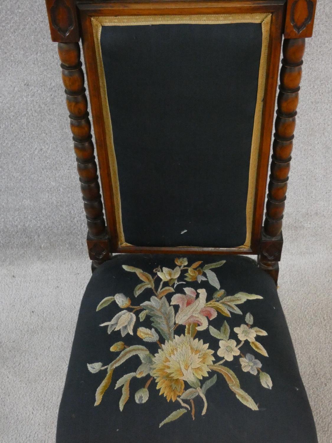 A late Victorian walnut Gothic carved prie dieu style side chair in floral tapestry upholstery. H. - Image 3 of 6