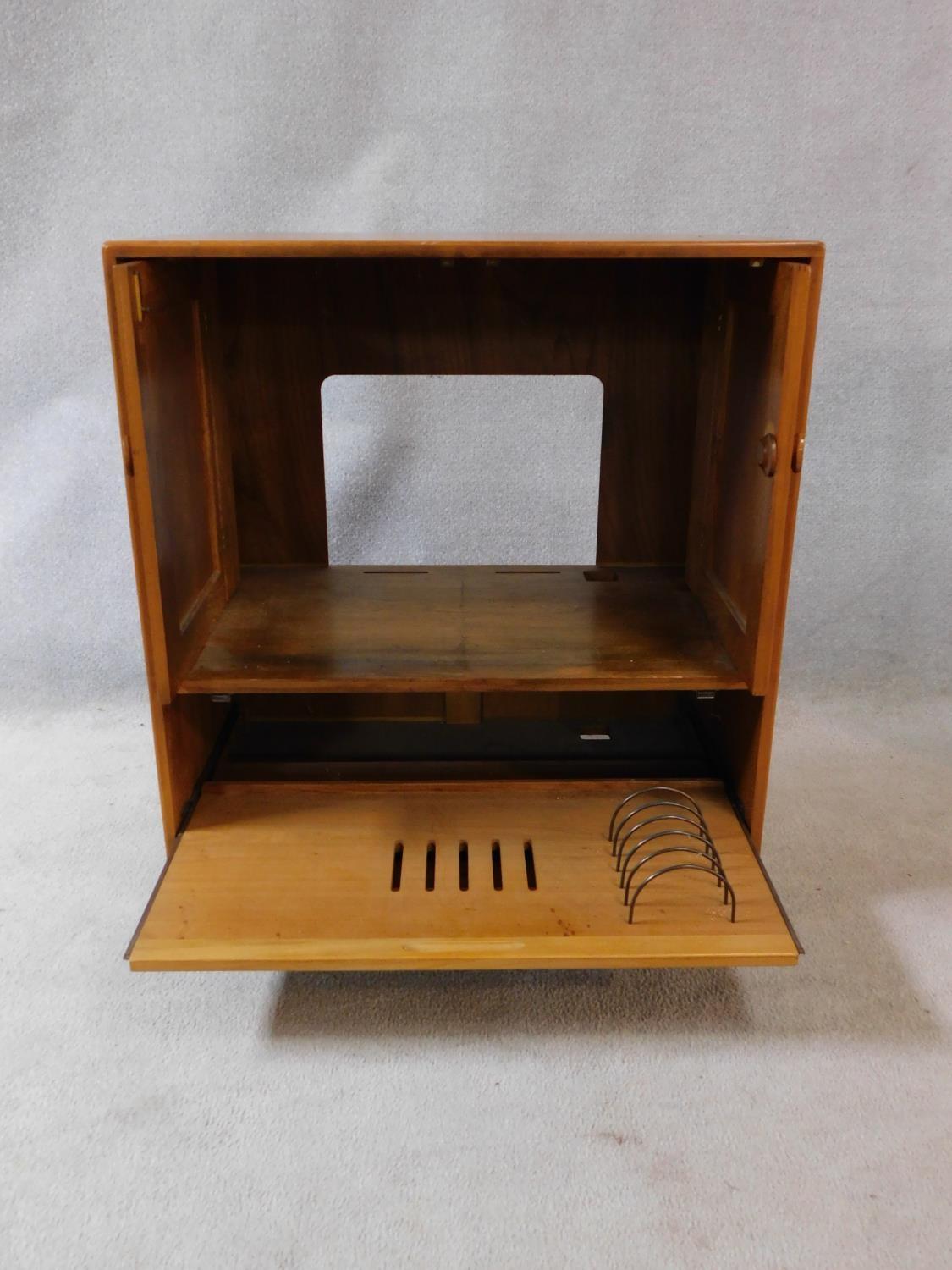 A vintage elm Ercol cabinet with panel doors and drop down base door fitted for HI Fi. H.94xW.85xL. - Image 3 of 13