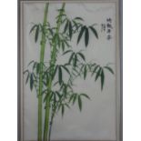 A 20th century framed and glazed Japanese silk painting of bamboo with characters and artists