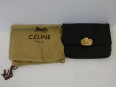 A black silk Celine clutch bag retailed by Fior of Knightsbridge, with original dust bag. H.14,5xW.