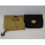 A black silk Celine clutch bag retailed by Fior of Knightsbridge, with original dust bag. H.14,5xW.