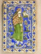 An antique Qajar Persian hand painted and polychrome glazed ceramic tile depicting a man in
