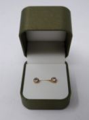 A pair of boxed 9ct yellow gold and cubic zirconia stud earrings. Posts and butterflies stamped 375.