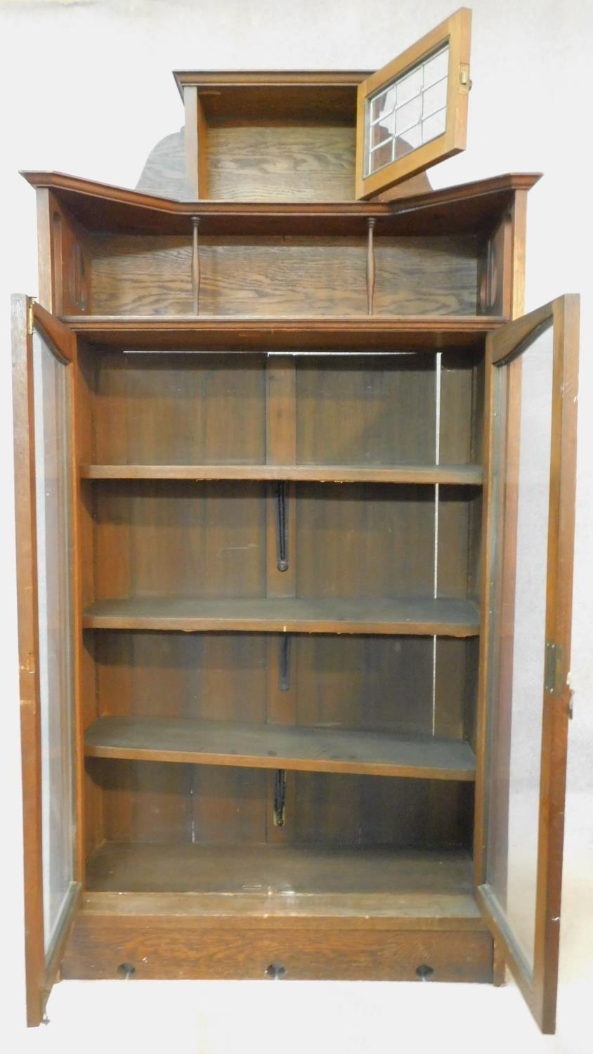 A late 19th century oak Art Nouveau bookcase in the Glasgow School style with leaded glazed - Image 2 of 8