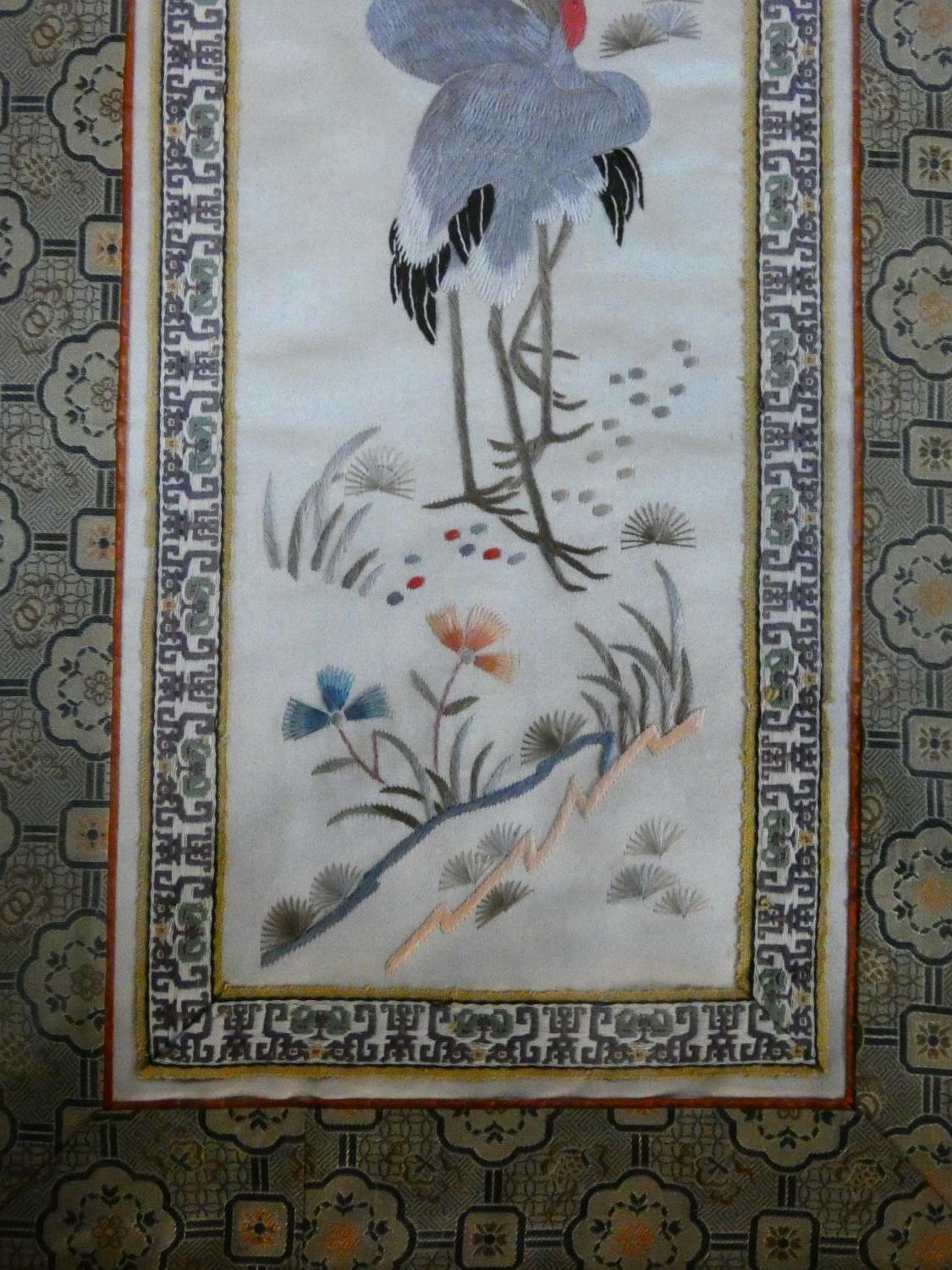 A framed and glazed Chinese panel, storks and foliate decoration within a stylized flowerhead - Image 4 of 5