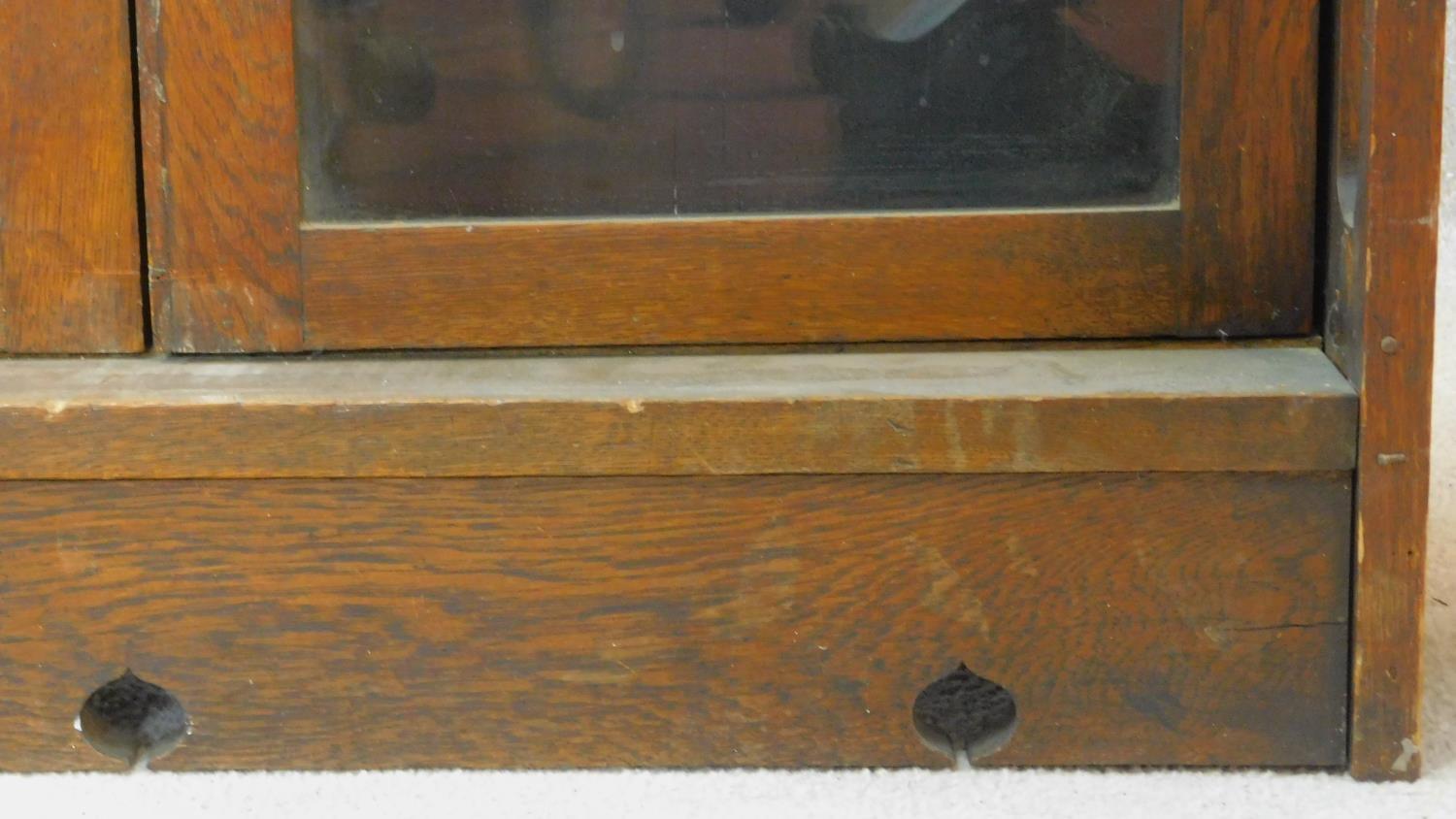 A late 19th century oak Art Nouveau bookcase in the Glasgow School style with leaded glazed - Image 6 of 8