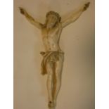 An antique carved ivory crucifix, intricately detailed, with Christ wearing a crown of thorns. H.