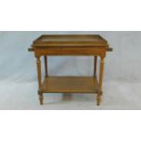 A late 19th century French walnut washstand with galleried top and towel rails on turned reeded