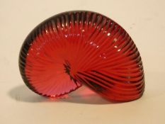 A Baccarat red crystal "Nautile" shell signed Baccarat and has makers stamp. 4.5x6cm