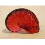 A Baccarat red crystal "Nautile" shell signed Baccarat and has makers stamp. 4.5x6cm