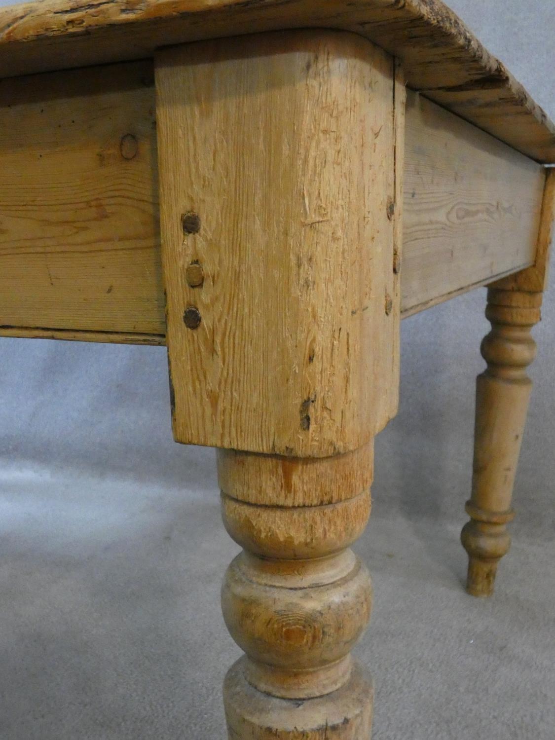 A Victorian pine kitchen dining table with planked top and end drawer on turned tapering supports. - Image 10 of 16