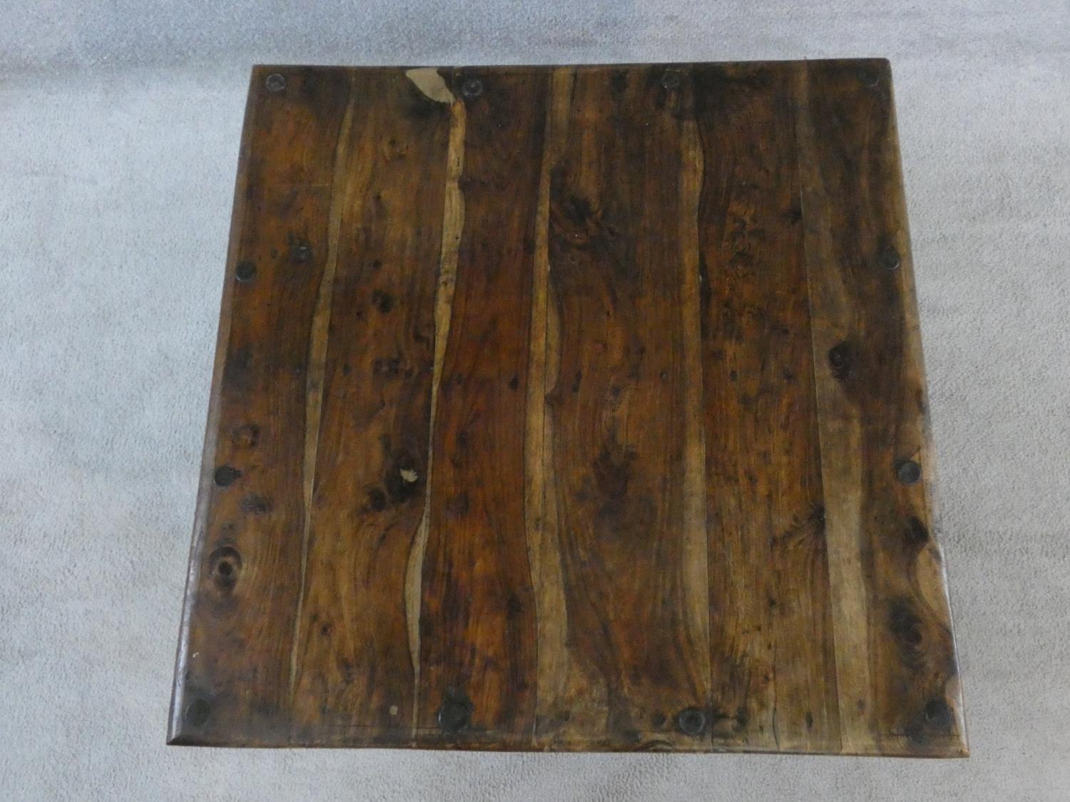 An Indian iron bound hardwood low table on circular section supports. H.42xW.80xL.80cm - Image 3 of 9