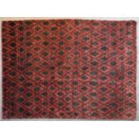 A contemporary rug with geometric diamond pattern and motifs on a burgundy field. L.220x155cm