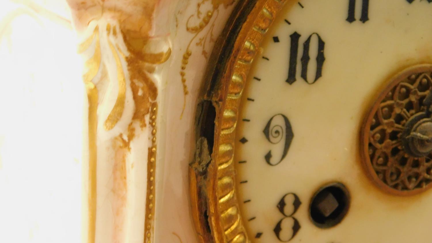 A porcelain hand painted antique gilded mantel clock with floral details and white enamel dial - Image 11 of 13