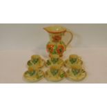 An Art Deco Minton espresso set with six cups and saucers with a bold colourful abstract design