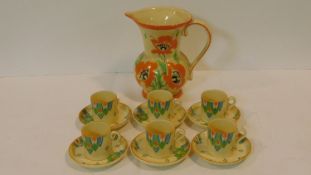 An Art Deco Minton espresso set with six cups and saucers with a bold colourful abstract design