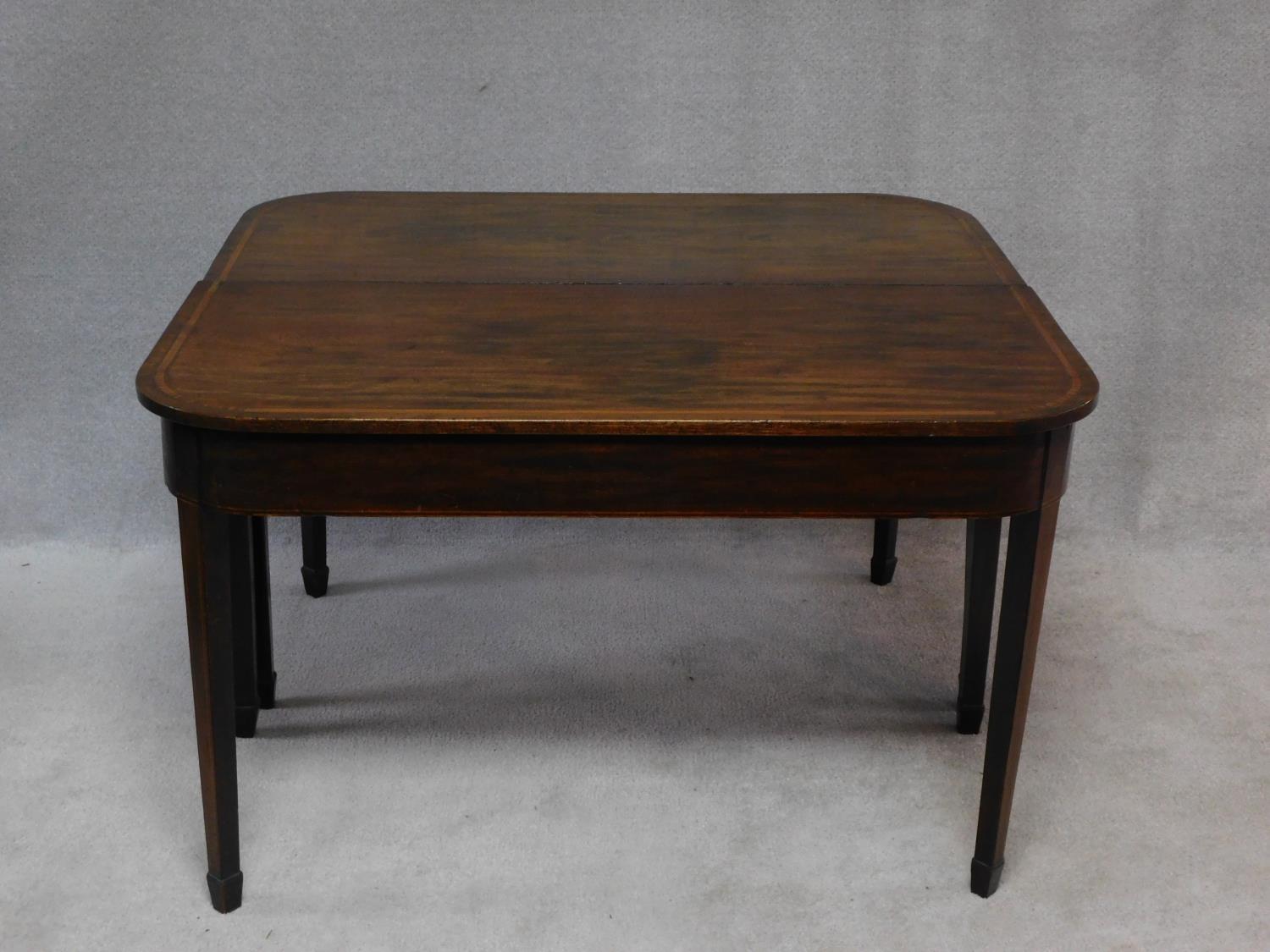 A late Georgian mahogany and satinwood strung D end dining table on square tapering supports and - Image 3 of 3