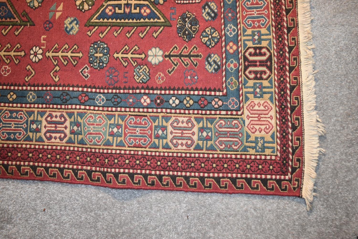 A Sumak Kilim with repeating pendant medallions on maroon ground surrounded by stylised floral and - Image 3 of 4