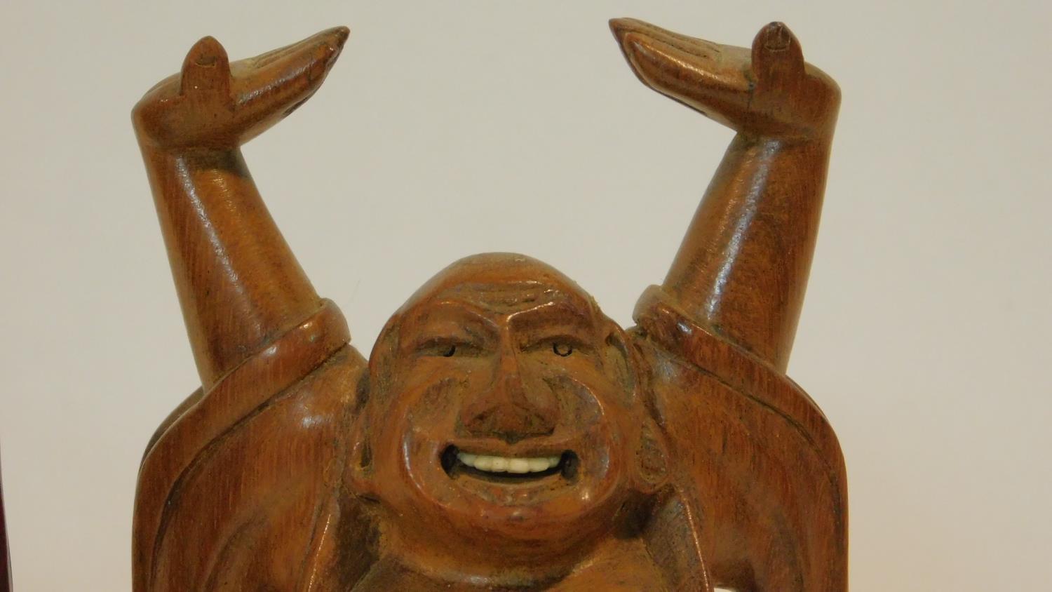 Three vintage carved Japanese hardwood happy Buddha's with raised arms, one with bone teeth along - Image 4 of 8