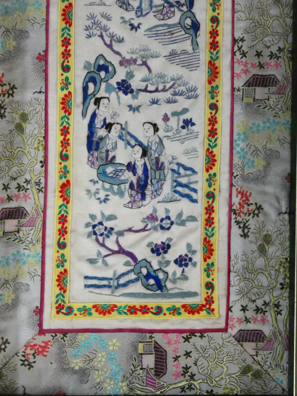 A 19th century Chinese framed and glazed silk panel, figures in a landscape within a floral woven - Image 4 of 5