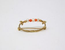 An antique 9 ct yellow gold foliate wreath design brooch threaded with natural pearls and coral