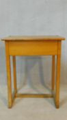 A vintage beech school desk with hinged lid revealing book compartment. H.80 W.62 D.42cm