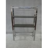 A vintage chrome and smoked glass two tier etagere. H.140xW.91xL.30cm