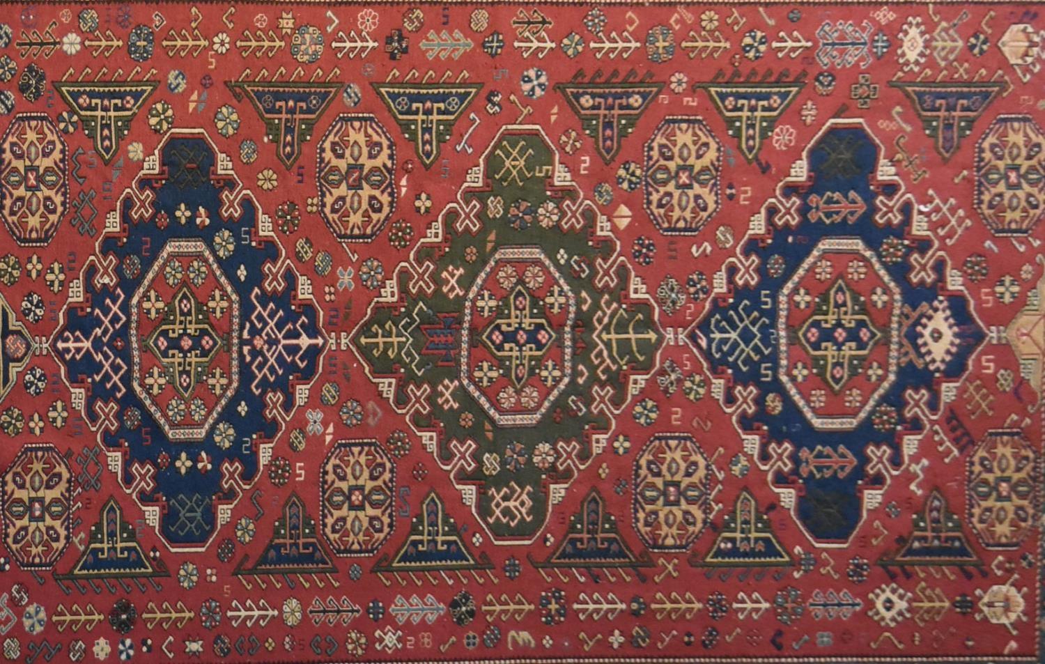 A Sumak Kilim with repeating pendant medallions on maroon ground surrounded by stylised floral and - Image 2 of 4