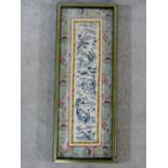 A 19th century Chinese framed and glazed silk panel, figures in a landscape within a floral woven