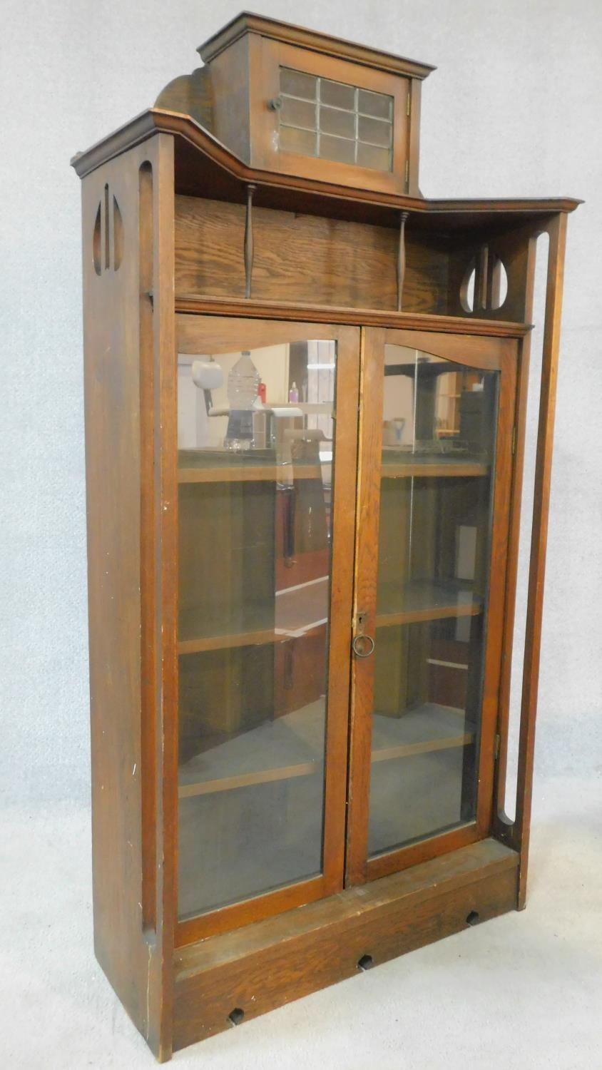 A late 19th century oak Art Nouveau bookcase in the Glasgow School style with leaded glazed - Image 3 of 8