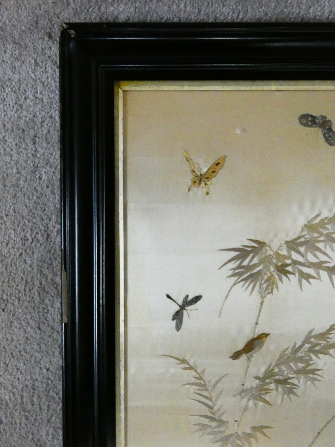 A late 19th century framed and glazed Chinese silk embroidery of a peacock with birds, butterflies - Image 4 of 7