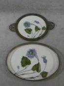 A pair of late 19th century German trays, hand painted with flower and leaf decoration, one with