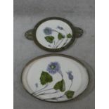 A pair of late 19th century German trays, hand painted with flower and leaf decoration, one with