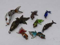 A miscellaneous collection of Chinese articulated fish pendants to include, bronze, silver and multi