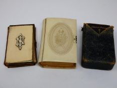 A 19th century leather bound bible with ivory cover and monogram, a similar in a faux ivory cover