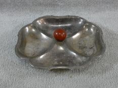 An Art Deco silver plated quatrefoil shaped sectional serving dish with central bakelite handle. H.