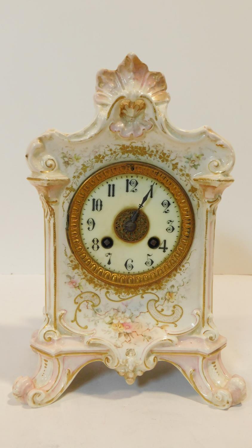 A porcelain hand painted antique gilded mantel clock with floral details and white enamel dial - Image 2 of 13