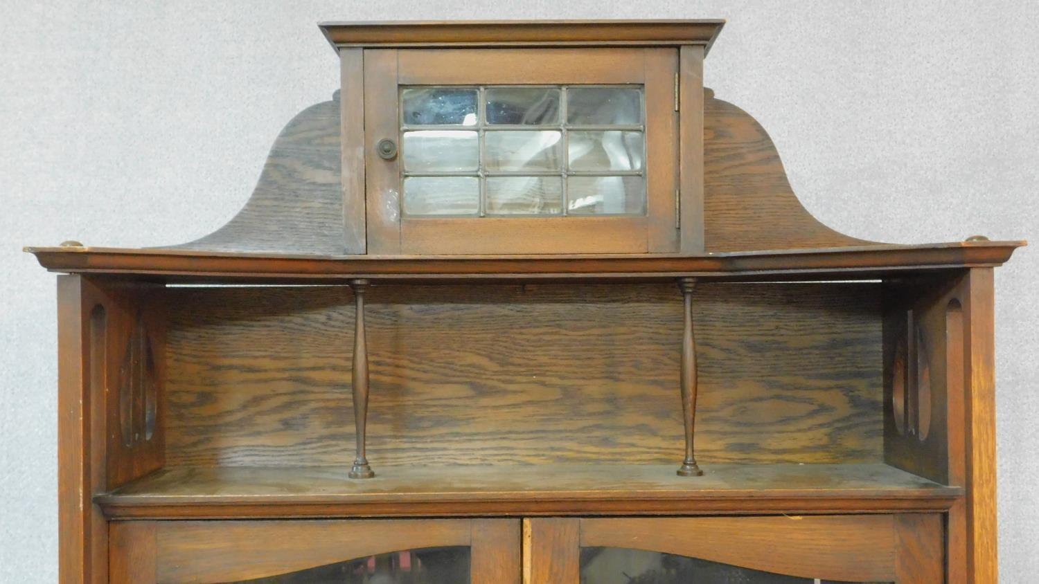 A late 19th century oak Art Nouveau bookcase in the Glasgow School style with leaded glazed - Image 4 of 8