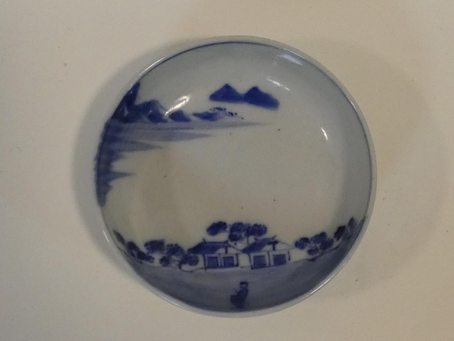 A Meji period blue and white ceramic Japanese bowl with hand painted village scene with mountains in - Image 2 of 8