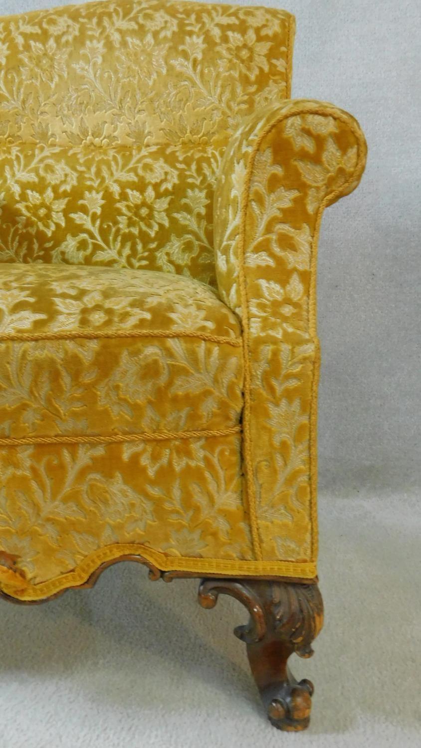 A pair of Georgian style armchairs in gold cut floral upholstery on walnut carved cabriole supports. - Image 4 of 10