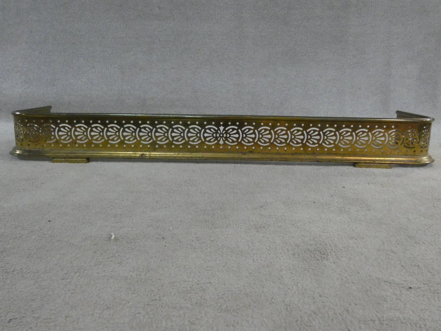 A 19th century pierced brass fire fender resting on stepped bracket feet. H.14xW.118xL.30cm - Image 3 of 5