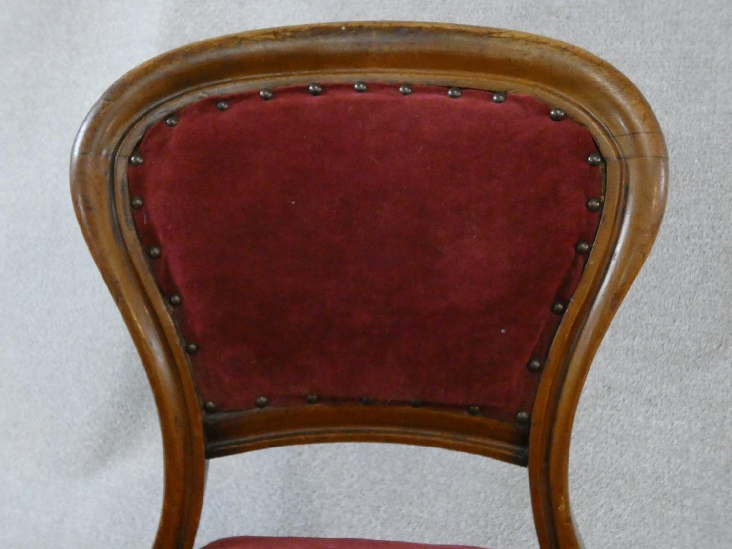 A set of four Victorian mahogany hooped back dining chairs in burgundy velour upholstery on reeded - Image 6 of 9