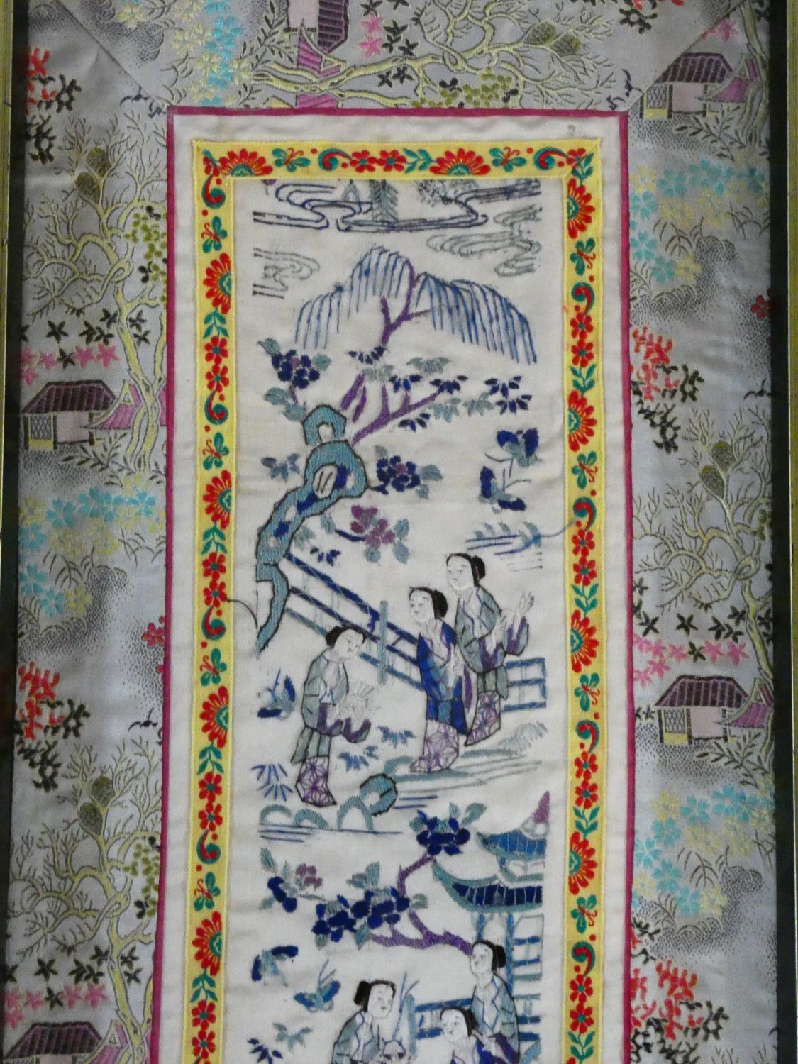 A 19th century Chinese framed and glazed silk panel, figures in a landscape within a floral woven - Image 2 of 5